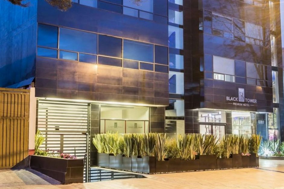 Hotel exterior facade at dusk with warm lighting